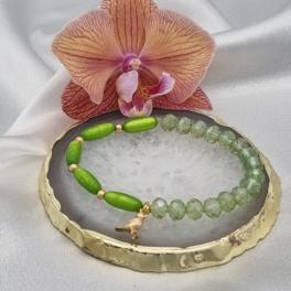 Handgemaakte armband met vergulde bedel - appelgroen