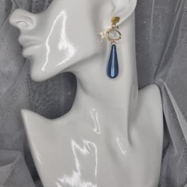 Vergulde statement oorbellen met polaris - blauw